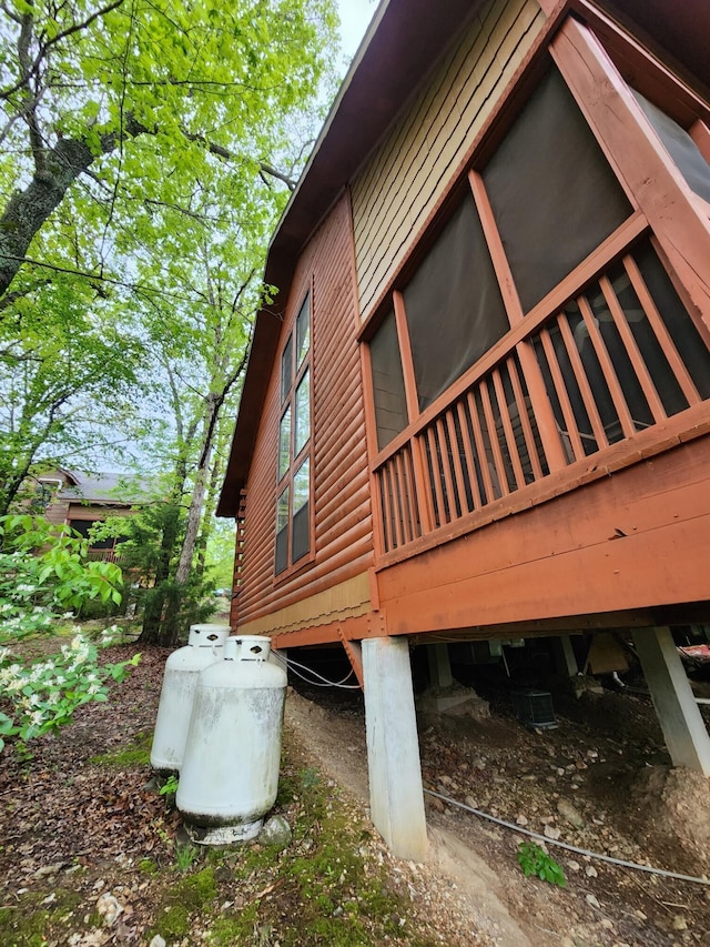 view of home's exterior with a wooden deck