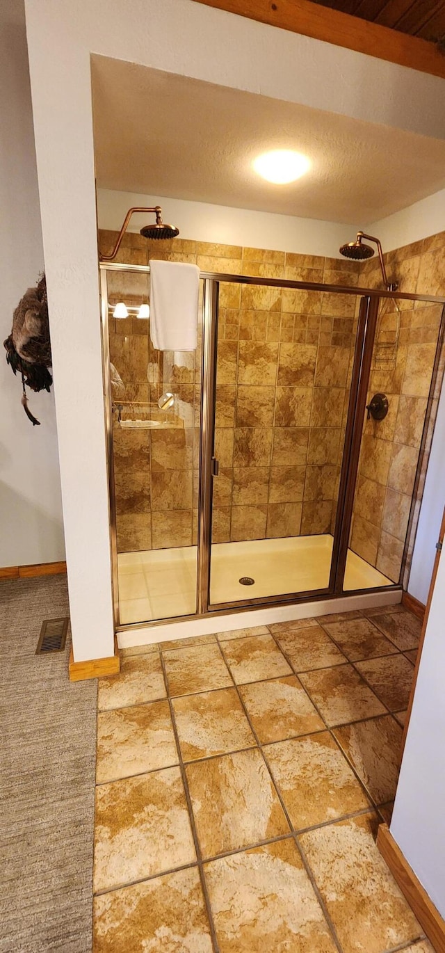 bathroom with an enclosed shower