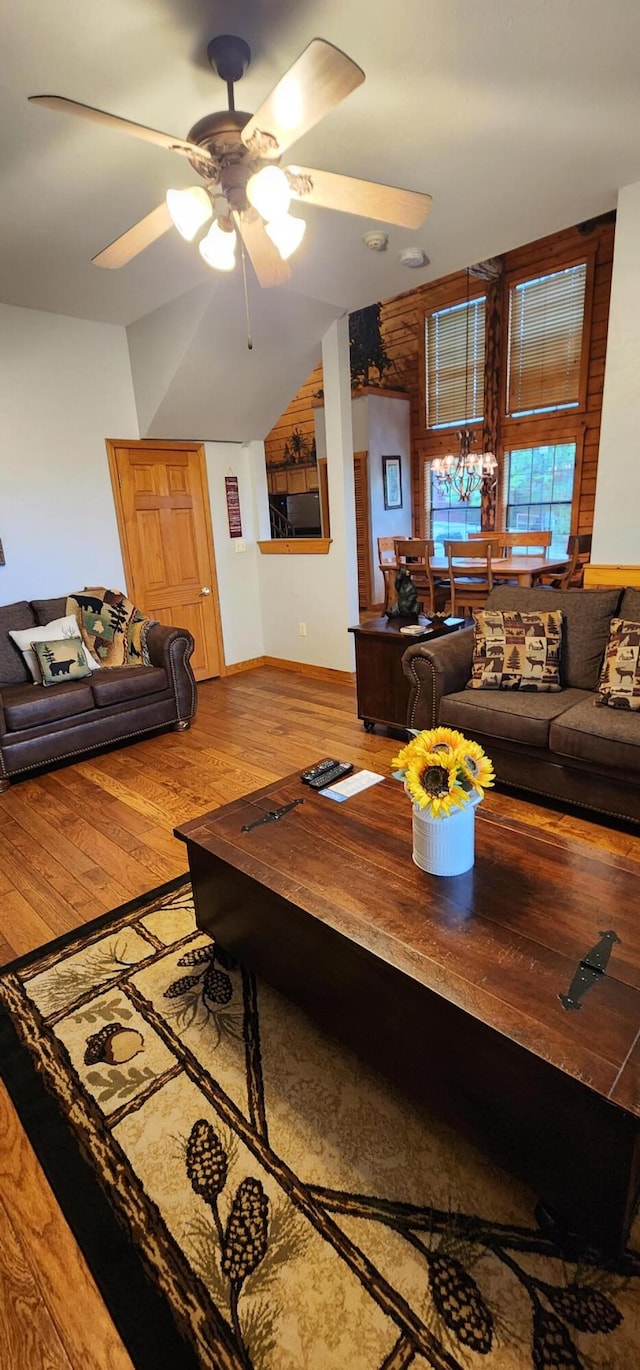 living room featuring hardwood / wood-style floors and ceiling fan