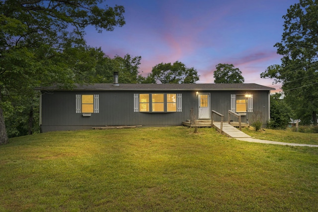 view of front of home with a lawn