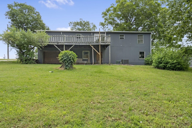 rear view of property with a yard, a wooden deck, and cooling unit