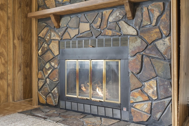 details featuring a stone fireplace