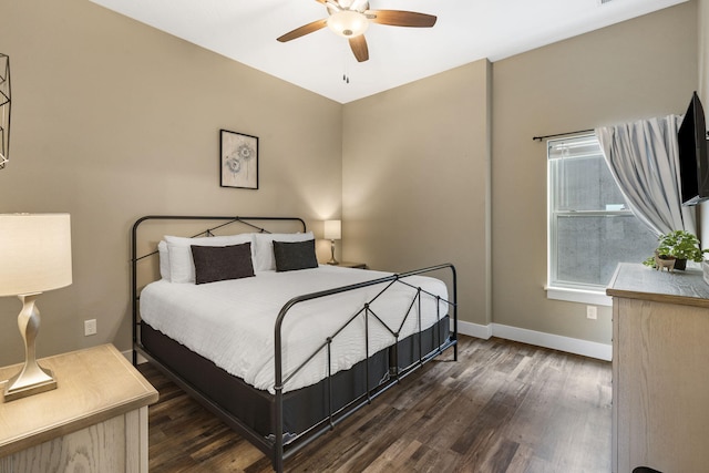 bedroom featuring baseboards, dark wood-style floors, and ceiling fan