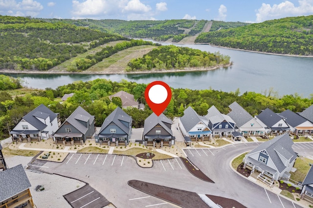 birds eye view of property featuring a water view