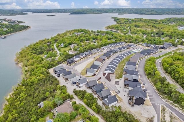 drone / aerial view with a residential view and a water view