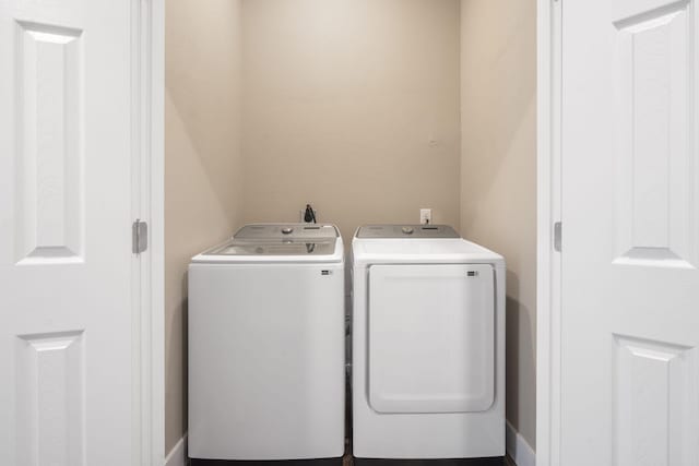 laundry area with washing machine and dryer