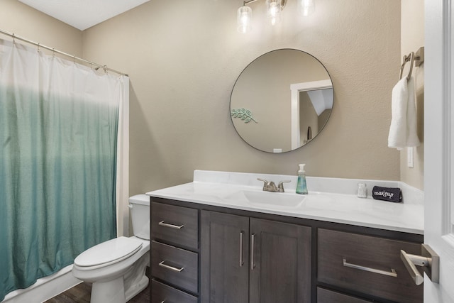 full bathroom featuring curtained shower, wood finished floors, toilet, and vanity