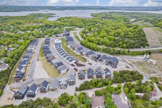 bird's eye view featuring a water view and a residential view