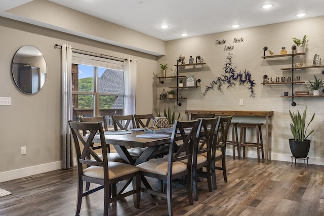 dining area with wood finished floors, baseboards, and recessed lighting