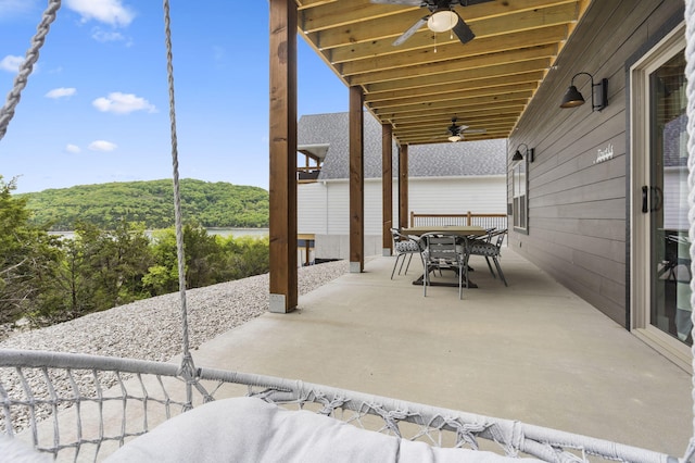 view of patio / terrace with outdoor dining area and a ceiling fan