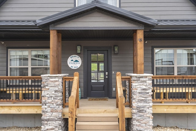 property entrance featuring covered porch