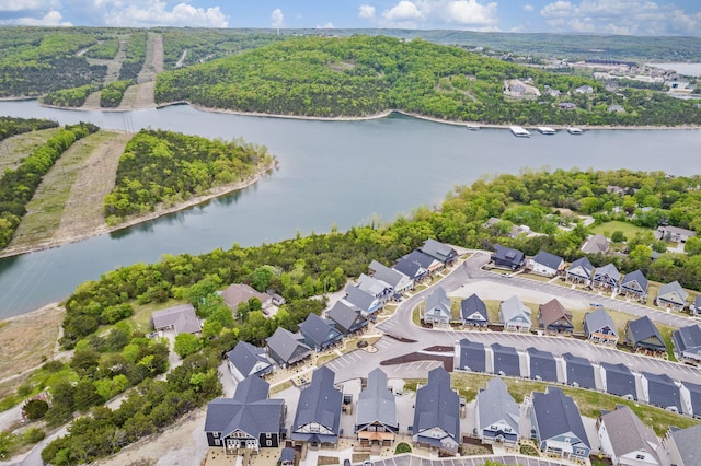 drone / aerial view with a residential view and a water view
