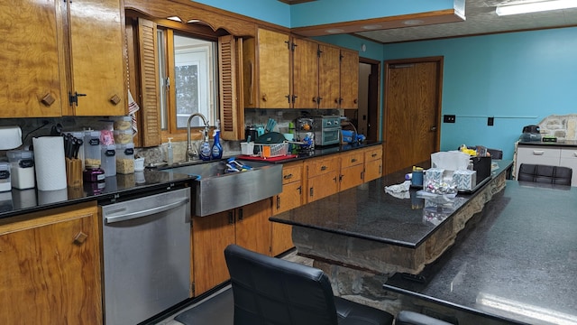 1404 6th St, Monett, MO 65708 - kitchen with brown cabinetry, stainless steel dishwasher, dark countertops, and a sink