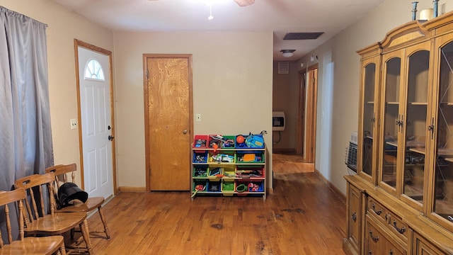 1404 6th St, Monett, MO 65708 - interior space with wood finished floors, visible vents, a ceiling fan, and baseboards