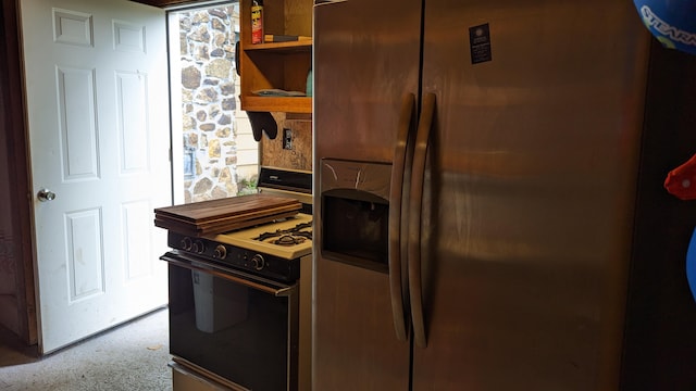 1404 6th St, Monett, MO 65708 - kitchen with range with gas cooktop, carpet floors, stainless steel refrigerator with ice dispenser, and open shelves
