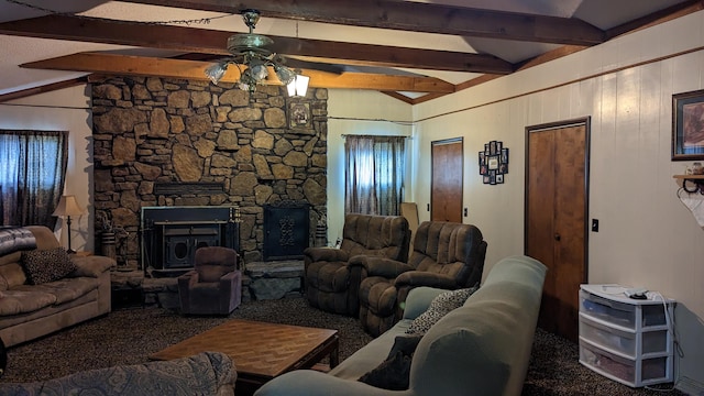 carpeted living room featuring ceiling fan, wooden walls, vaulted ceiling with beams, and a fireplace