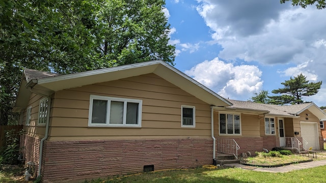 view of side of property featuring a garage