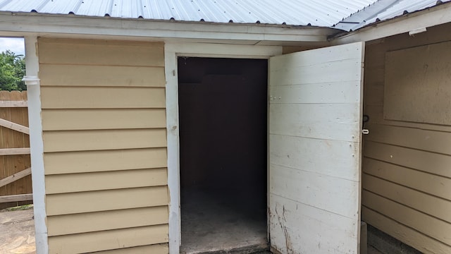1404 6th St, Monett, MO 65708 - view of exterior entry featuring metal roof and fence