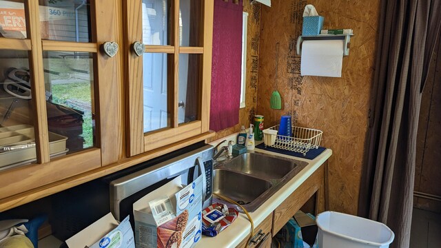 1404 6th St, Monett, MO 65708 - interior space featuring wooden walls and a sink