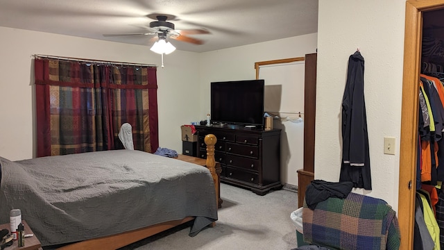 bedroom featuring ceiling fan and light colored carpet