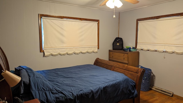 bedroom featuring ceiling fan and wood-type flooring