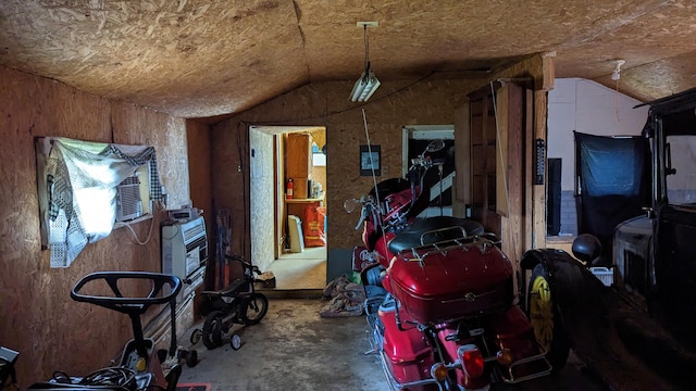 1404 6th St, Monett, MO 65708 - interior space featuring vaulted ceiling and unfinished concrete flooring