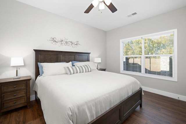 bedroom featuring ceiling fan and dark hardwood / wood-style flooring