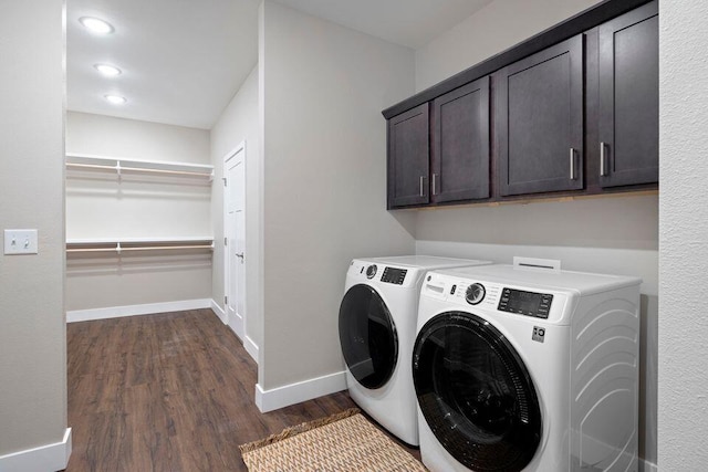 laundry room featuring cabinets, dark wood-type flooring, and independent washer and dryer