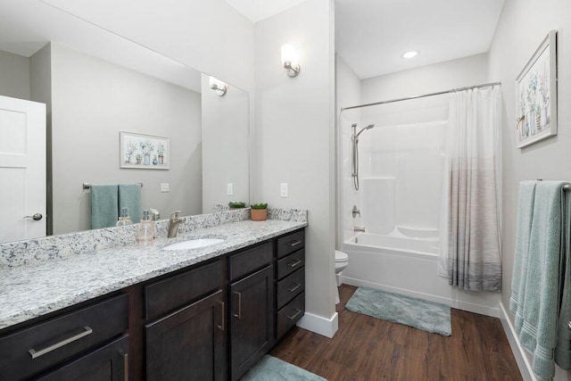 full bathroom with vanity, hardwood / wood-style floors, shower / bath combination with curtain, and toilet