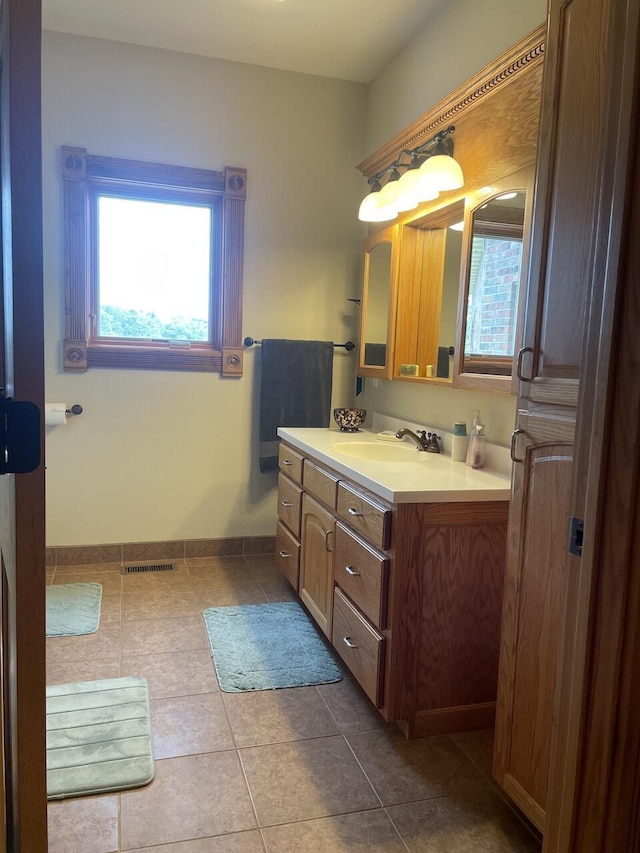 1179 County Road 1050, Willow Springs, MO 65793 - bathroom with visible vents, plenty of natural light, vanity, and tile patterned flooring