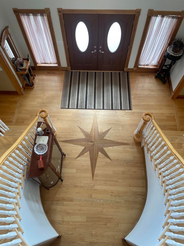 entrance foyer with light hardwood / wood-style flooring