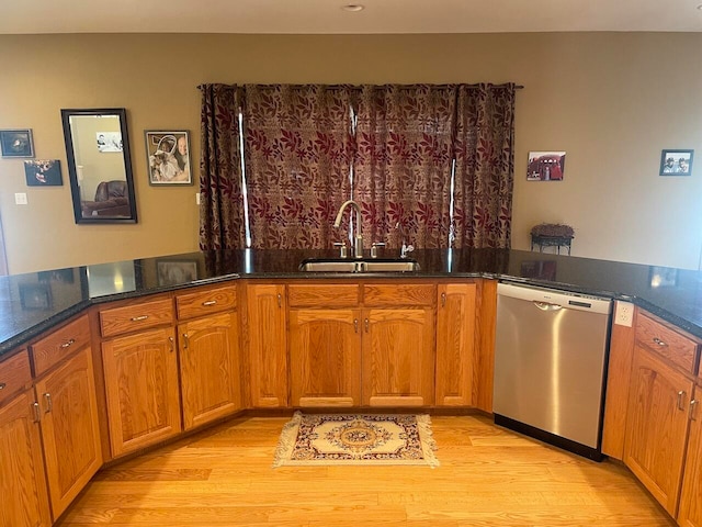 kitchen with sink, light hardwood / wood-style floors, and dishwasher