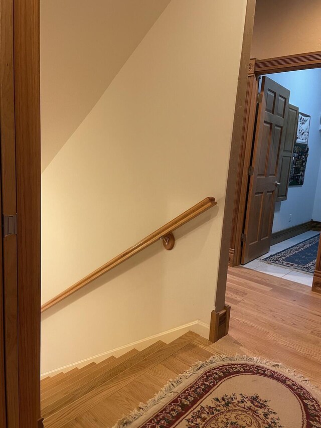 1179 County Road 1050, Willow Springs, MO 65793 - stairs featuring baseboards and wood finished floors