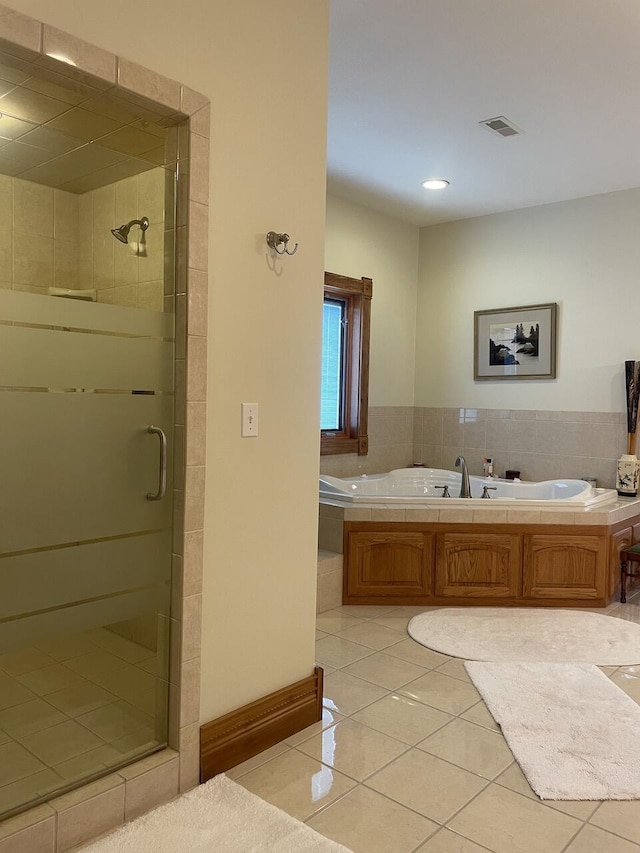 1179 County Road 1050, Willow Springs, MO 65793 - bathroom featuring a garden tub, visible vents, tile patterned flooring, and a stall shower