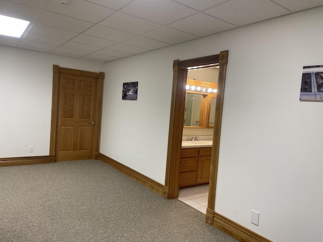 1179 County Road 1050, Willow Springs, MO 65793 - empty room featuring baseboards, light colored carpet, and a paneled ceiling