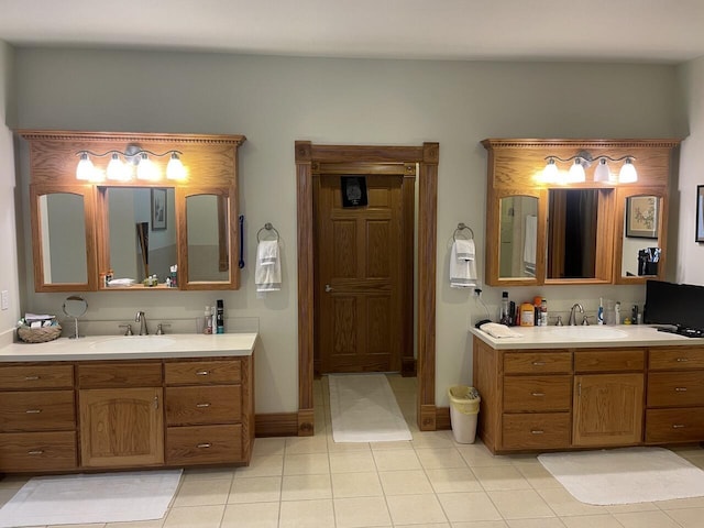 1179 County Road 1050, Willow Springs, MO 65793 - bathroom with two vanities, tile patterned floors, a sink, and baseboards