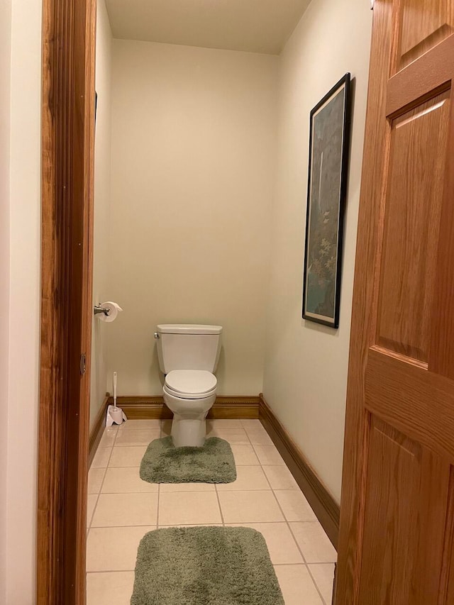 bathroom with tile patterned flooring and toilet