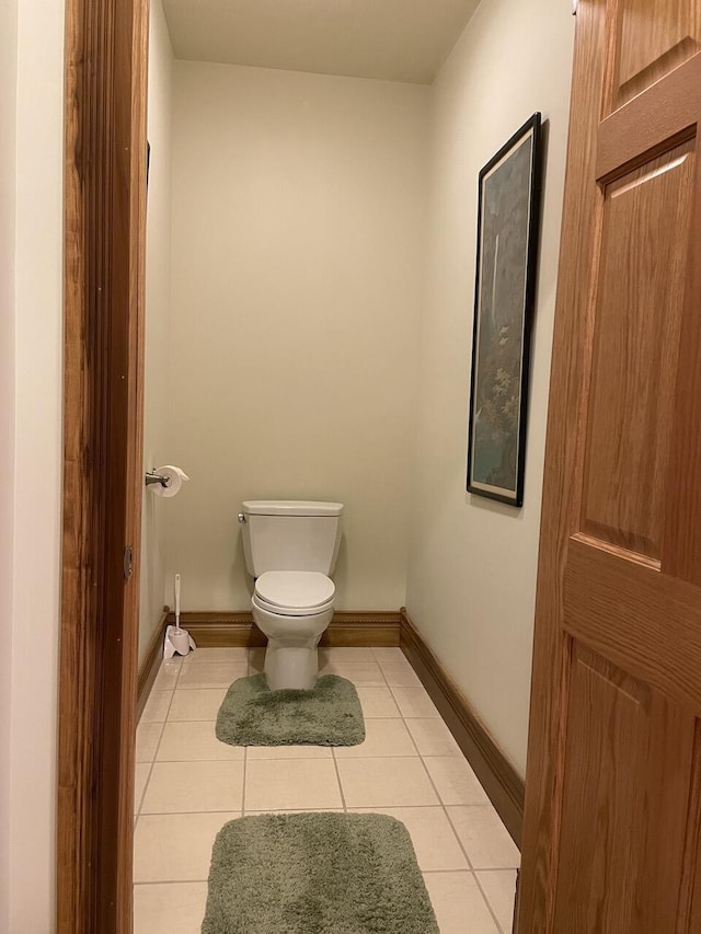 1179 County Road 1050, Willow Springs, MO 65793 - bathroom featuring tile patterned flooring, toilet, and baseboards