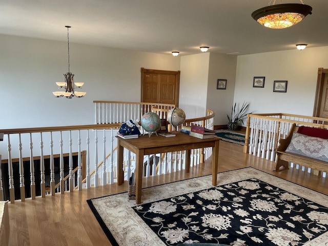 1179 County Road 1050, Willow Springs, MO 65793 - interior space with wood finished floors and an inviting chandelier