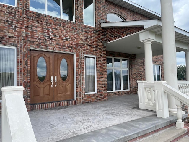 doorway to property featuring covered porch