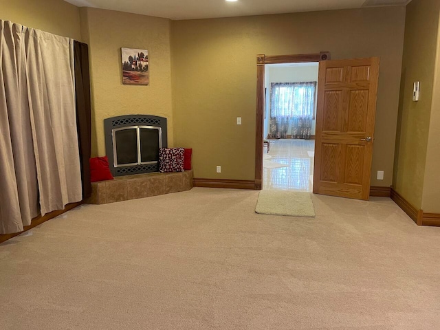 unfurnished living room featuring carpet floors