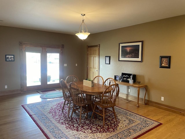 1179 County Road 1050, Willow Springs, MO 65793 - dining area with baseboards, french doors, and light wood-type flooring