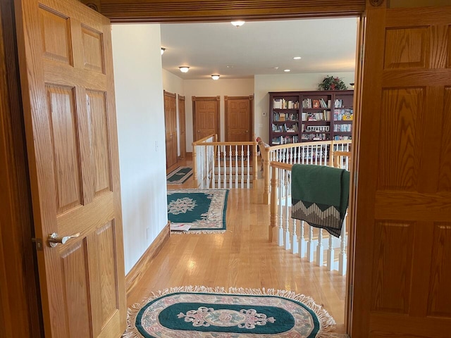 corridor with light wood-type flooring