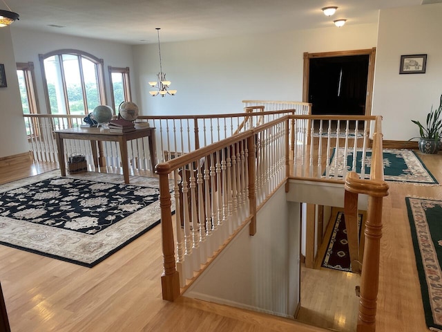 1179 County Road 1050, Willow Springs, MO 65793 - interior space with baseboards, wood finished floors, and an inviting chandelier