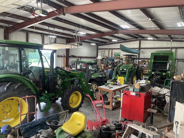 1179 County Road 1050, Willow Springs, MO 65793 - garage featuring a garage door opener and a workshop area