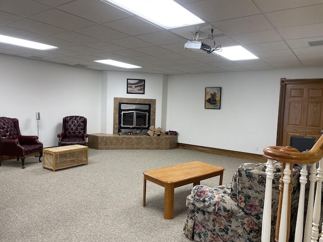 1179 County Road 1050, Willow Springs, MO 65793 - carpeted living room with a premium fireplace, visible vents, a drop ceiling, and baseboards