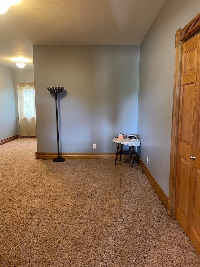 unfurnished room with carpet floors