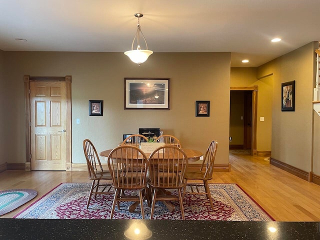 dining area with hardwood / wood-style flooring