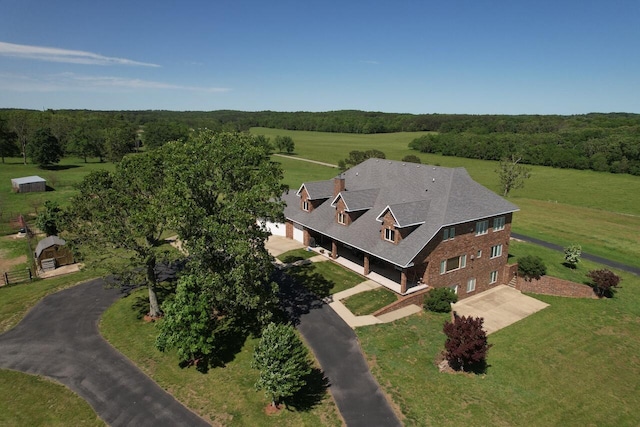 birds eye view of property featuring a rural view