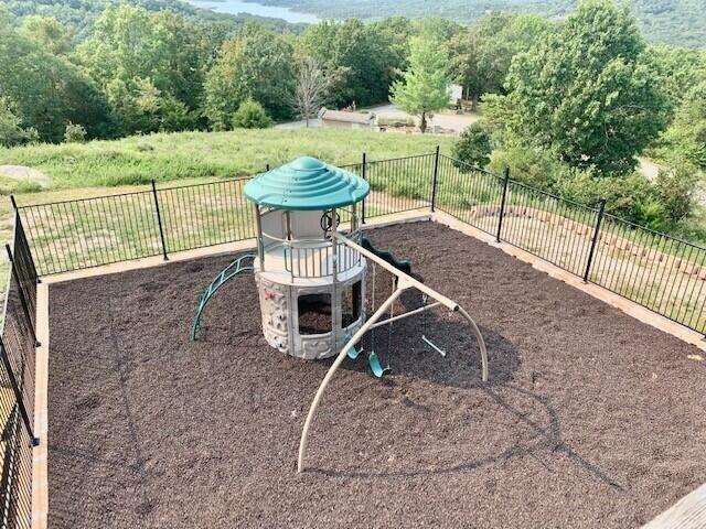 view of property's community featuring a playground